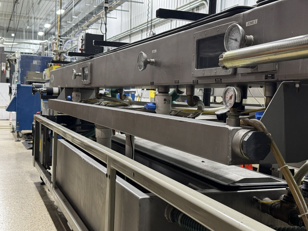 Extrusion production line with gauges and downstream equipment