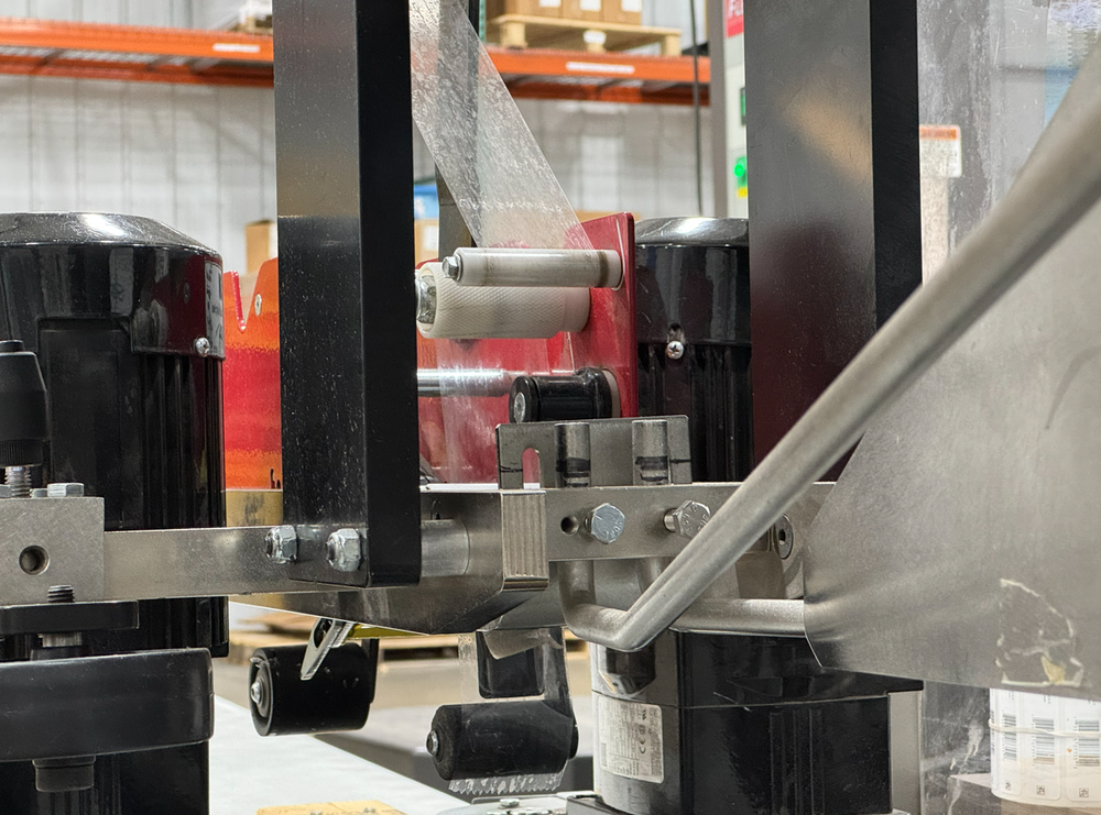 Tape head on packaging equipment at Stang Precision
