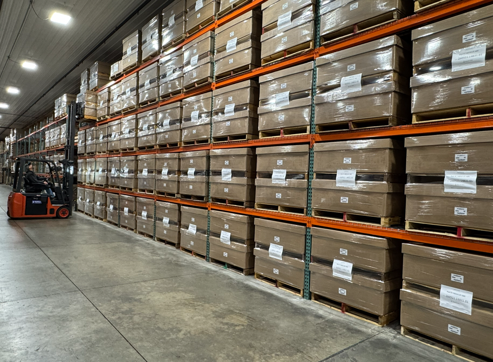 Finished goods stored on warehouse racks at Stang Precision